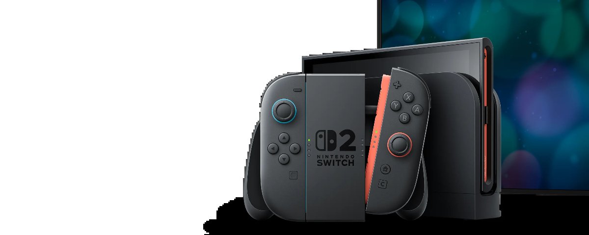 Mandos Joy-Con 2 grises con detalles azul y rojo montados en su soporte, delante de la base de la consola y de un televisor, sobre fondo blanco